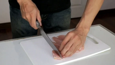 Chopping Chicken for grilling Stock Footage 74008535