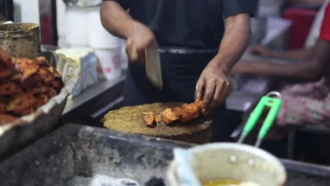 Chopping chicken legs Stock Footage 131702468