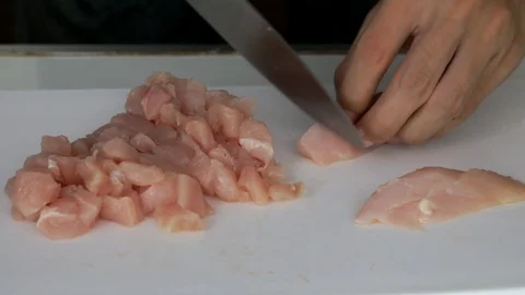 Chopping Chicken for merinade Stock Footage 74008544
