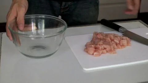 ​ Chopping chickens in kitchen Stock Footage 74008387