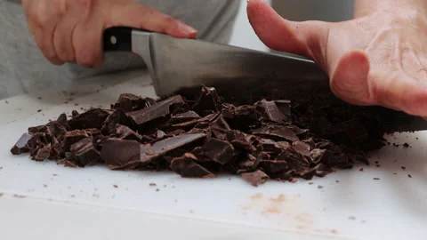 Chopping Chocolate with large knife Stock Footage 200969717