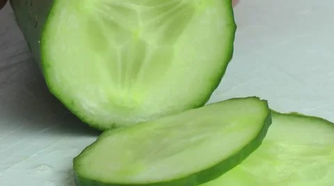 Chopping Cucumber with knife in the kitchen Stock Footage 68035729