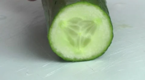 Chopping Cucumber with knife in the kitchen Stock Footage 68036279