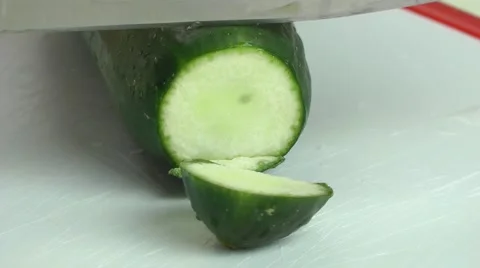 Chopping Cucumber with knife in the kitchen Stock Footage 68036302