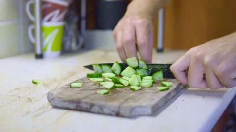 Chopping cucumber for salad, chef fast hands Stock-Footage 219624107