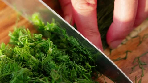 Chopping dill with a knife Stock Footage 326907751