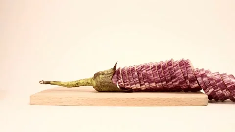 Chopping eggplant. Stop motion animation. Stock Footage 137450448
