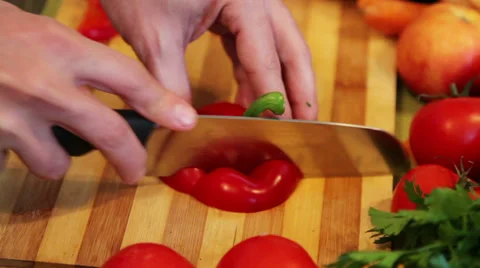 Chopping the end of a red bell pepper Stock Footage 34253992