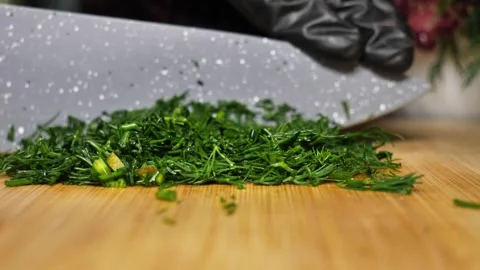 Chopping Fresh Dill with Knife  Culinary Close-Up Stock Footage 311543902