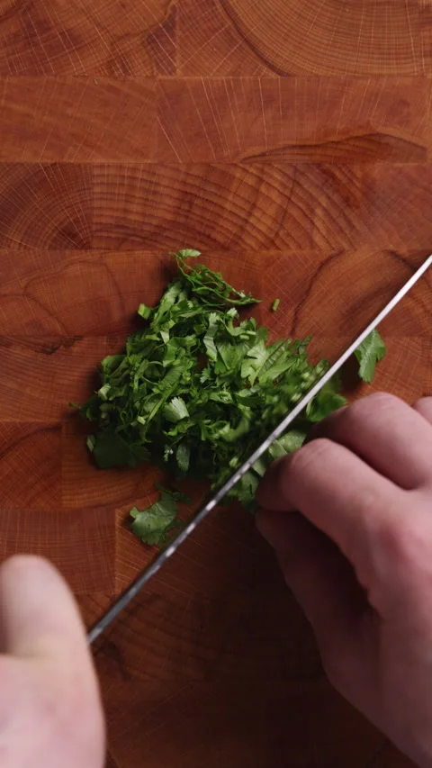 Chopping Fresh Parsley Close Up Vertical Top View Видео 336569818