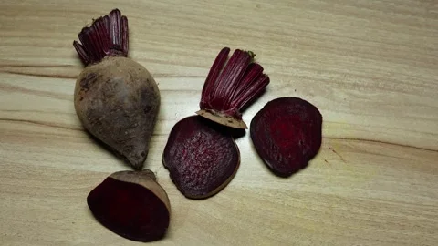 Chopping Fresh Raw beetroot Close-Up on wood board Background studio shot Stock Footage 296615550