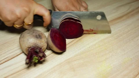 Chopping Fresh Raw beetroot Close-Up on wood board Background studio shot Stock Footage 298175547