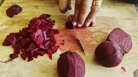 Chopping Fresh Raw beetroot Close-Up on wood board Background studio shot Stock Footage 304481142