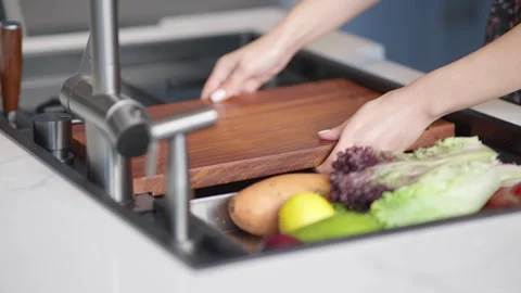 Chopping fresh vegetables on a cutting board Stock Footage 336466251