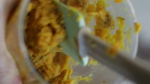 Chopping fried vegetables in a blender, vertical video Stock Footage 169728706