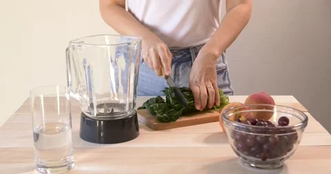 Chopping frozen spinace Stock Footage 148186964