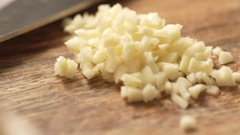 Chopping garlic on a cutting board. Stock Footage 265855886