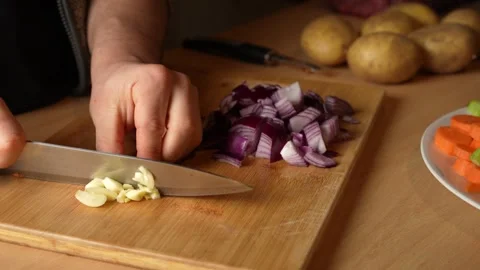 Chopping Garlic in the Kitchen Stock Footage 304638187