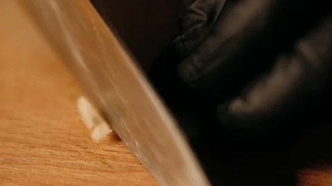 Chopping garlic with the knife Stock Footage 125458473