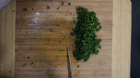 Chopping garlic overhead Stock Footage 120462318