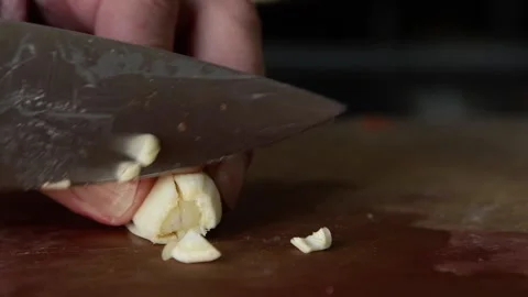 Chopping garlic with sharp knife Stock Footage 269870742