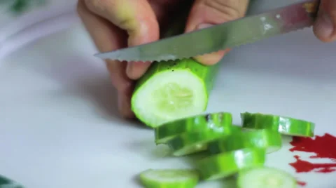Chopping a green cucumber Stock Footage 35223735