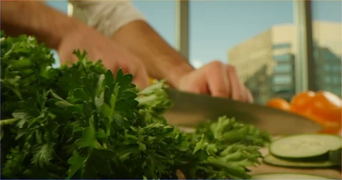 Chopping greenery, sliding over cooking table Видео 126302559