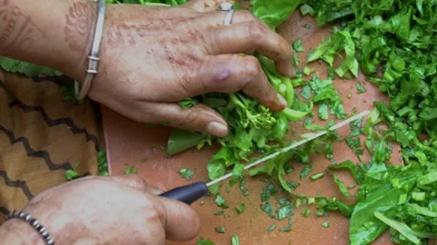 Chopping greens leafy or sarson ka saag Stock Footage 274399872