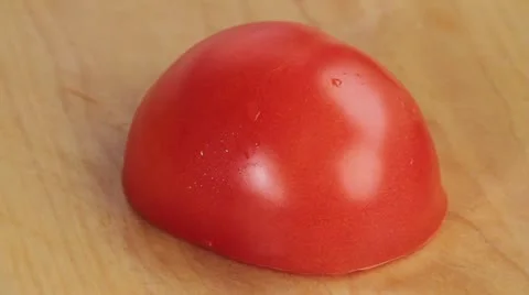Chopping half a tomato roughly Stock Footage 24654352