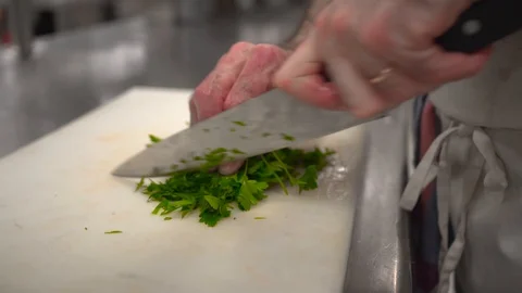 Chopping herbs on a table Stock Footage 86697971