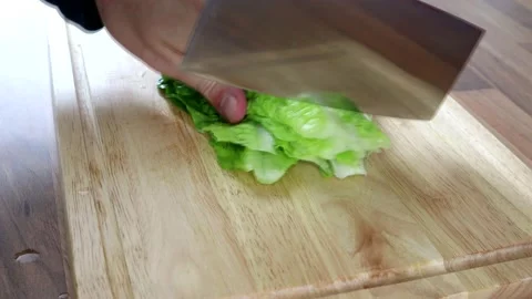 Chopping Lettuce Up With A Large Kitchen Knife 스톡 동영상 136736974