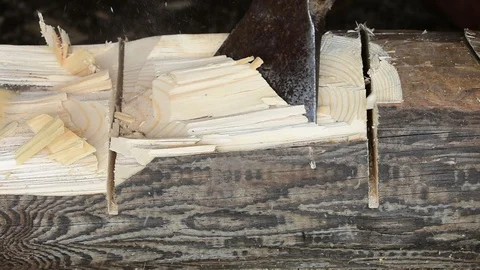 Chopping a log with an ax, close-up Stock Footage 117472744