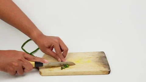 Chopping Long Beans on a Cutting Board Stock Footage 327852458