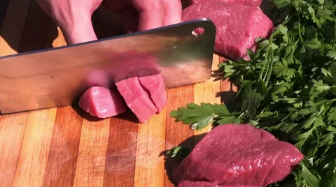 Chopping meat with a meat cleaver Stock Footage 39908907