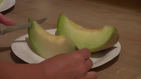 Chopping a melon slice,cutting cantaloupe, knife, slicing fresh fruit Stock Footage 47485732