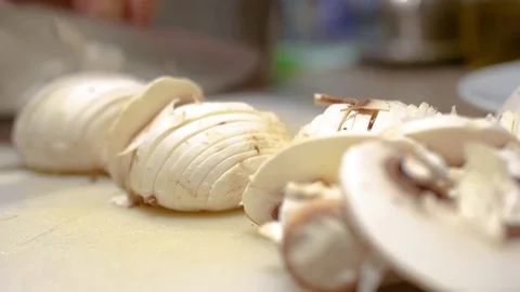 Chopping mushrooms with knife Stock Footage 78977847