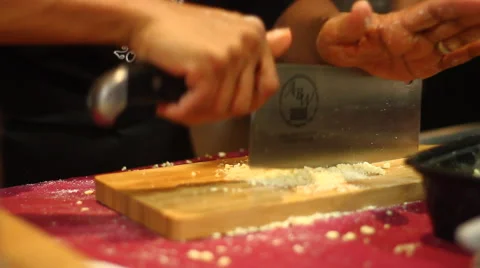 Chopping Nuts with Big Knife Stock Footage 46782324
