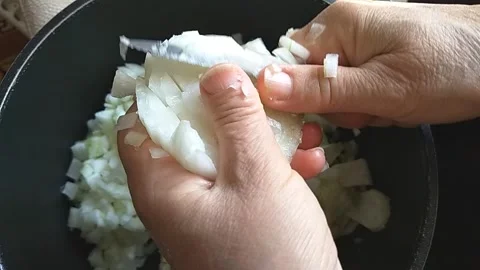Chopping onion in her hand Stock Footage 137408191