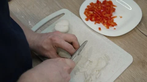 Chopping Onions in the Kitchen Stock Footage 311599814