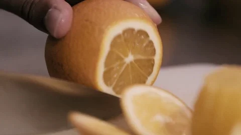Chopping up an orange in to pieces Stock Footage 78031340