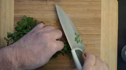 Chopping parsley overhead Stock Footage 120462296