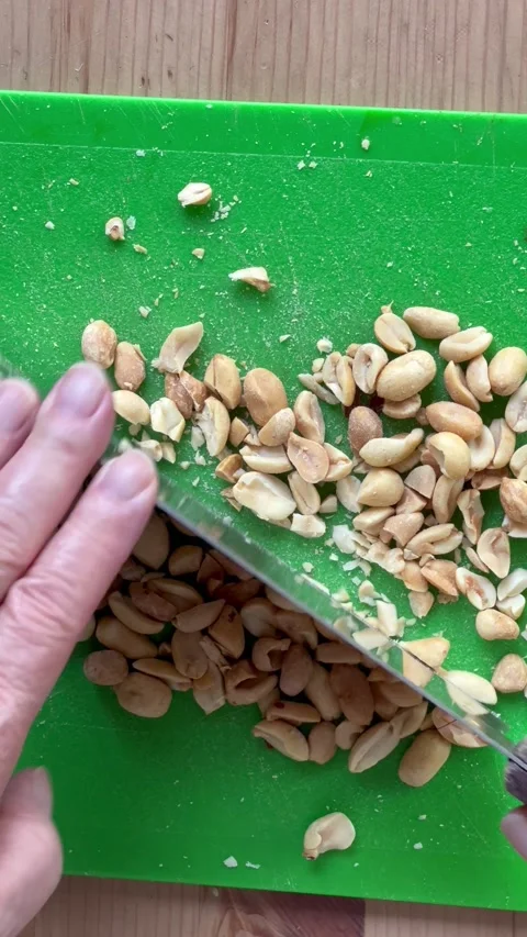 Chopping peanuts vertical Stock Footage 219236943