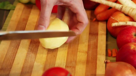 Chopping a potato Stock Footage 34253990