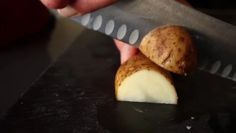 Chopping potatoes with a knife 스톡 동영상 172512382