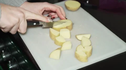 Chopping potatoes with a knife Stock Footage 329933934