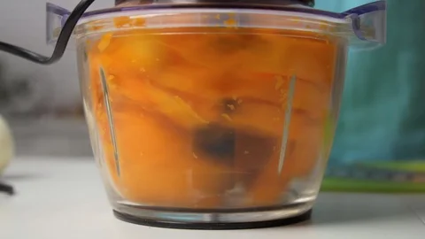 Chopping pumpkin cubes in food processor Stock Footage 122516542