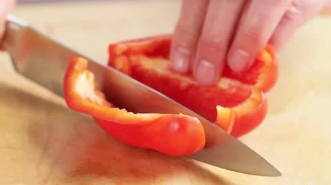 Chopping a red pepper Stock Footage 24664116