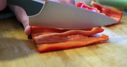 Chopping red pepper in the kitchen Stock-Footage 145873796