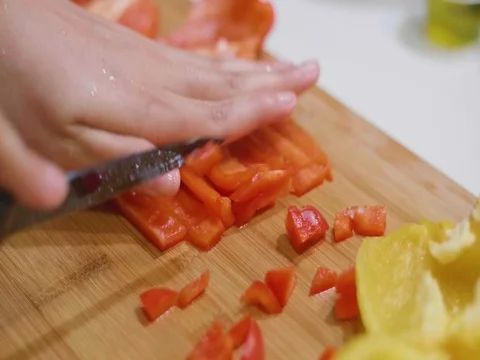 Chopping red peppers in slow motion Stock Footage