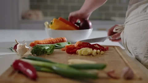 Chopping Scallions in slowmotion Stock Footage 254589936